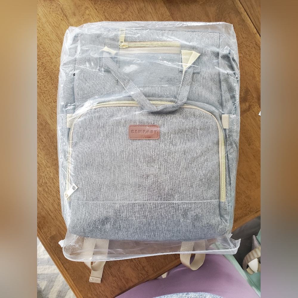 Diaper bag backpack with built in changing pad